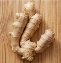 Ginger root on a wooden surface