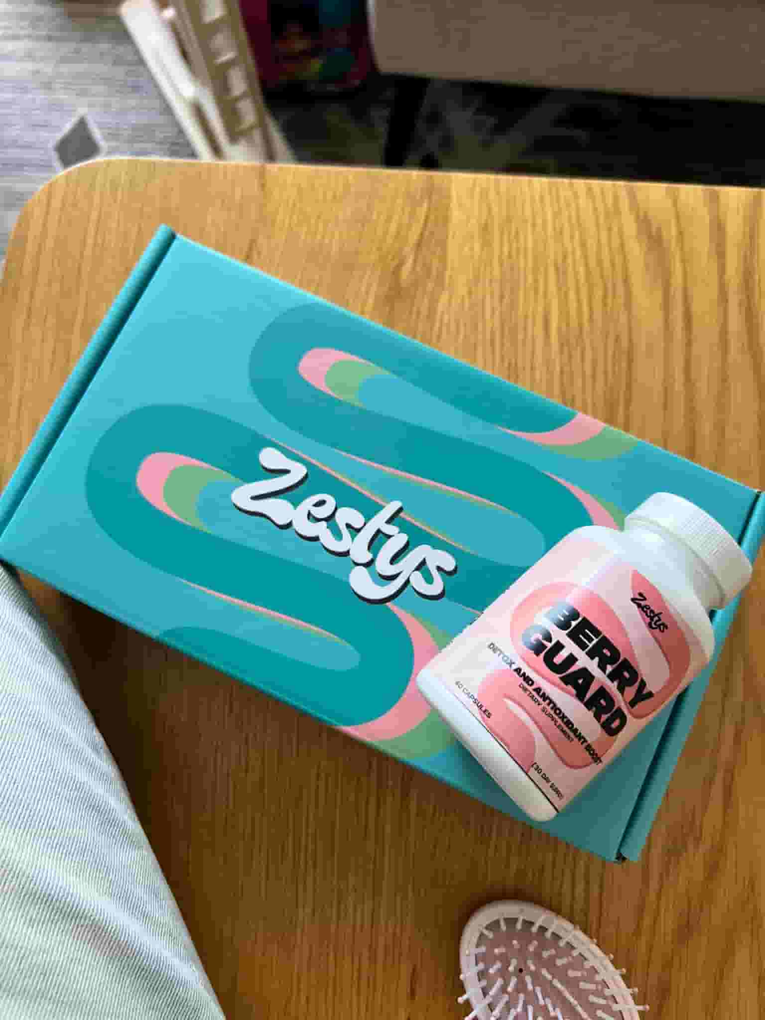 Zestys product packaging on a wooden surface